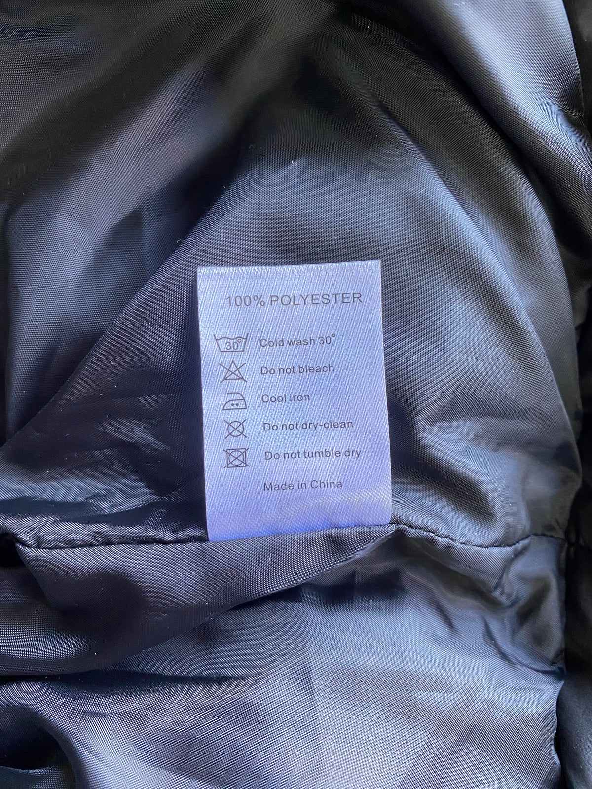 Charcoal Puffer Vest — care
