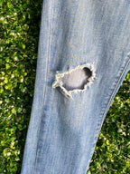 Levi's Mid-Wash Distressed Curvy Skinny Jeans — detail