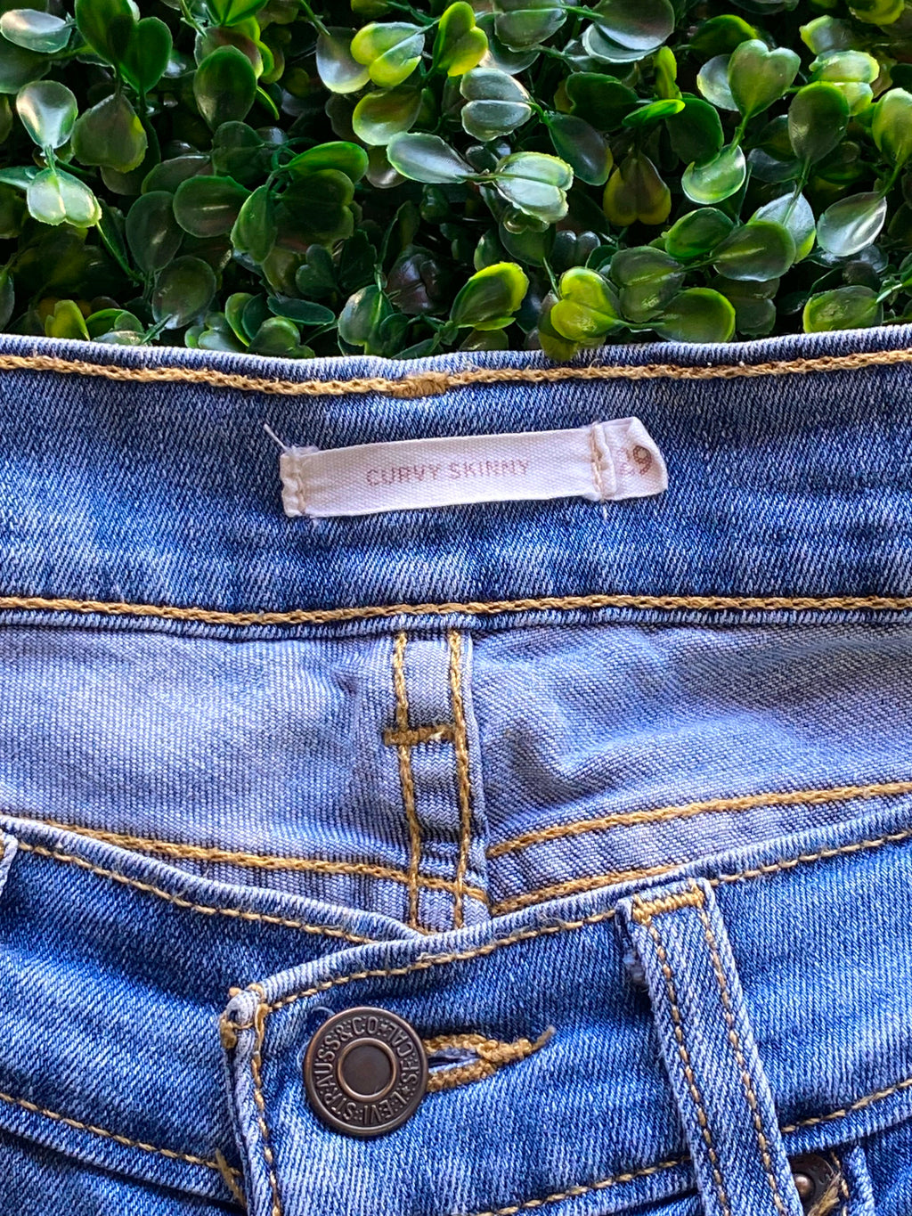 Levi's Mid-Wash Distressed Curvy Skinny Jeans — detail